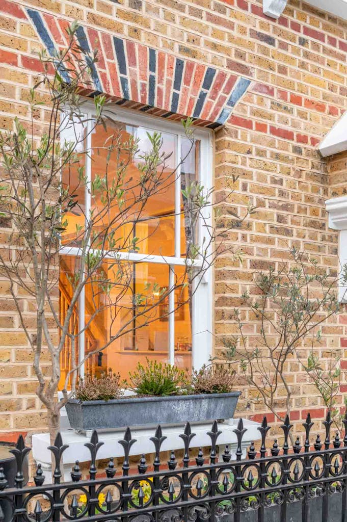 Wooden Box Sash Window taken from the front of the home with Yellow London Brick