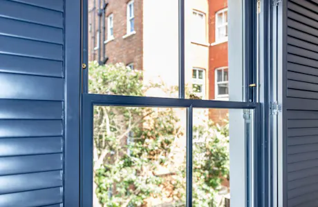 British-made-sash-window-with-wooden-shutters-1024x683