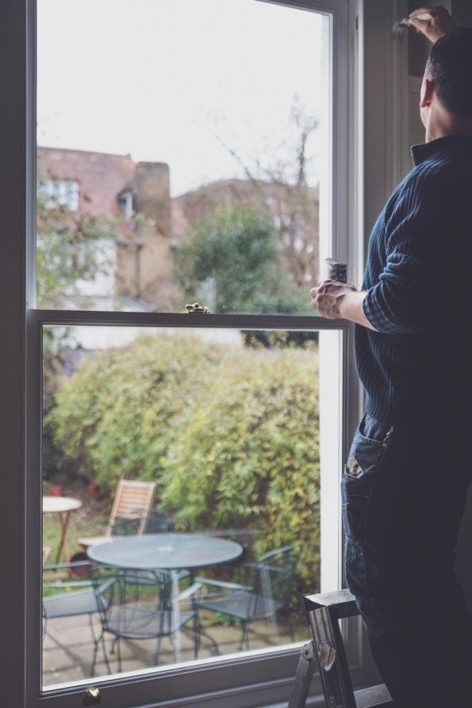 Our-Craftmen-working-on-Final-touches-on-sash-window-683x1024