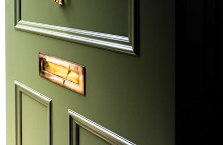 Ruvigni-Gardens-Brass-Front-Door-Furniture-on-Green-Door-683x1024