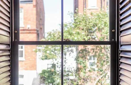 Sash-window-with-verytical-bar-and-shutters-1024x683