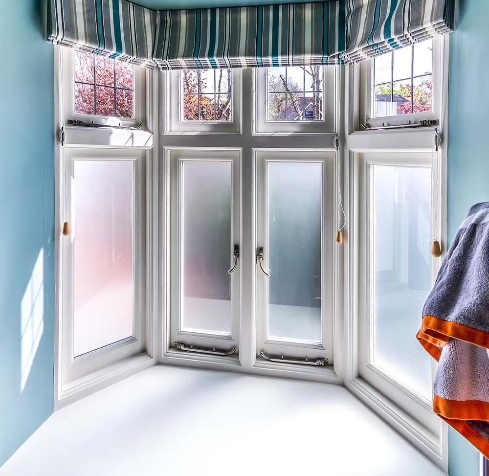 roman blinds on a bay casement window